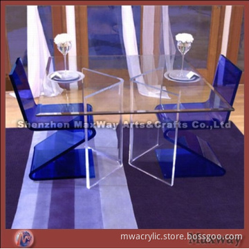 Modern transparent acrylic/perspex table and blue chairs for restauraunt